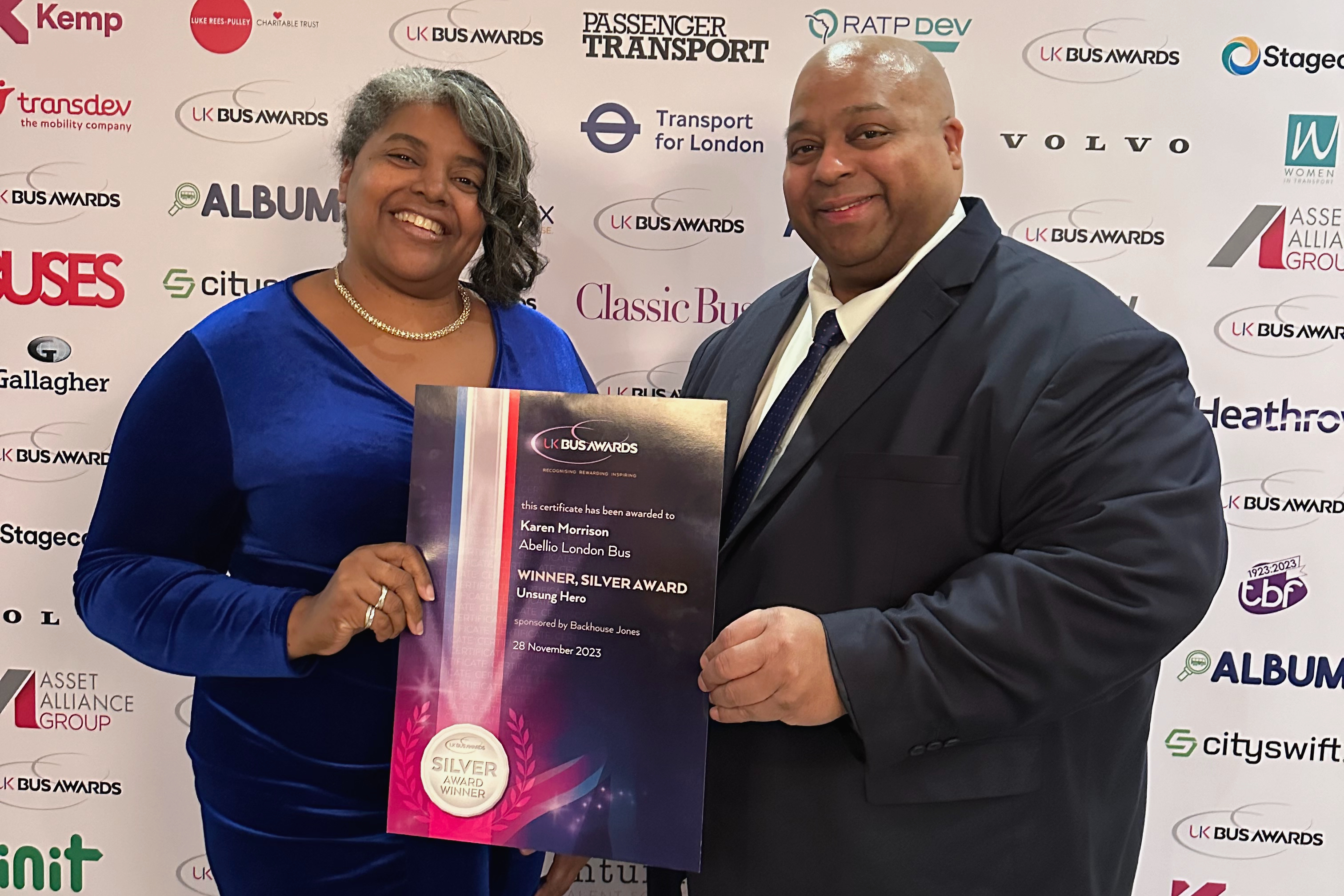 Karen Morrison receiving her silver winner award at the UK Bus Awards with Jason Dyett